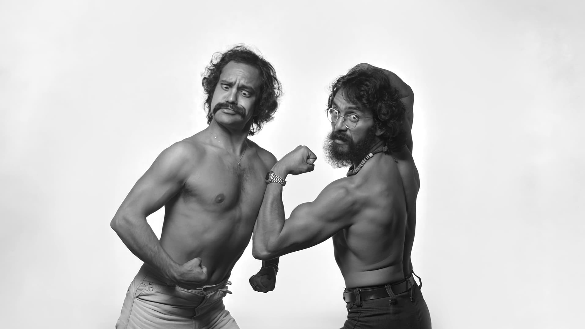 A black and white publicity photograph of Cheech Marin and Tommy Chong from the 1970s